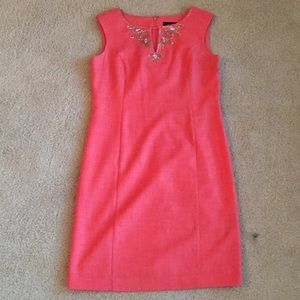 Coral dress with neck detail.